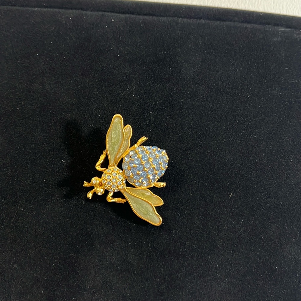 Classy brooch with blue cubic zirconia stones.  Vintage